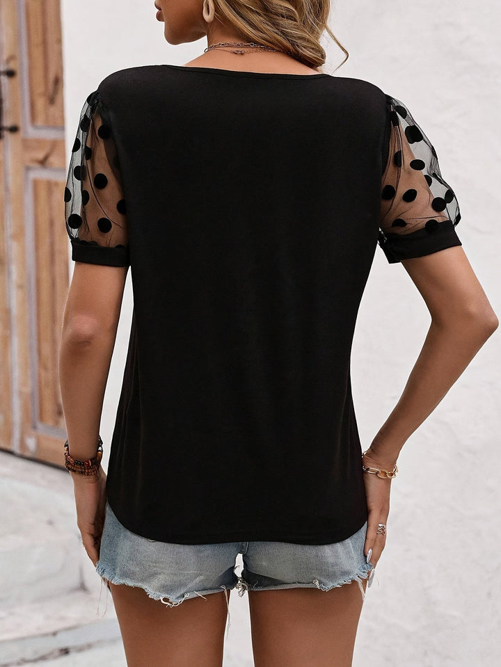 Danna - T-shirt noir élégant avec manches à pois à la mode